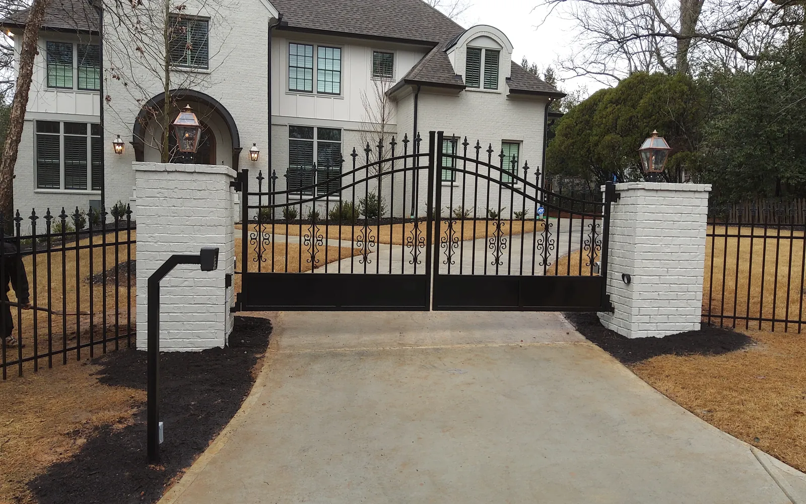 Custom ornamental swing gate from Georgia Gate & Fence featured projects